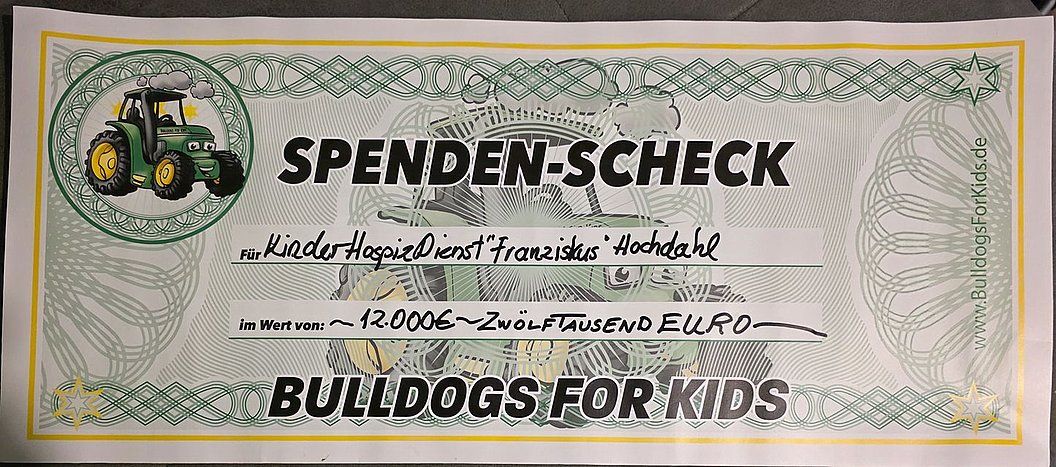 Spenden-Scheck i. W. v. 12.000 €